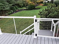 <b>White Ultralox Alta aluminum rails with cable rail infill-deck gate on Trex Select Pebble Gray composite deck boards</b>